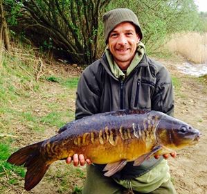 Committee member Gary Nicholls with a pristine mirror from Marston Pit 